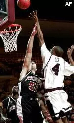 Gabe Lee shoots over Fordham's Mushon Ya'akosi during first half action.