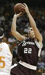 UMass' Jeff Viggiano (22) shoots over Tennessee's Ron Slay (35) during the first half.