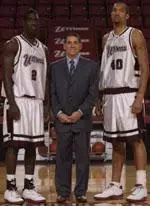 UMass seniors Jackie Rogers (left) and Micah Brand (right), shown with head coach Steve Lappas (center), will play their final regular-season home Saturday vs. St. Joseph's.