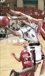 Gabe Lee tries to shoot around the defense of Saint Joseph's' Dwayne Jones during the first half.