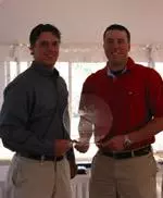 UMass co-captains Tom Ellerbrook (left) and John Seed (right) accepting the 2003 Atlantic 10 East Division Championship trophy.