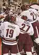 The hockey team celebrates its dramatic 5-4 overtime victory over Boston University.