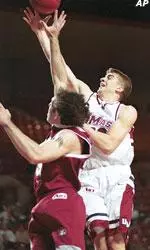 Jeff Viggiano shoots over Fordham's Mushon Ya-akosi during the first half.
