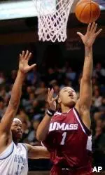 Rashaun Freeman flies past Rhode Island's J.R. Moore on his way to the basket during the first half.