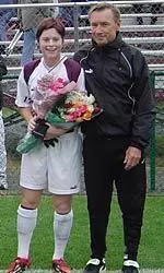 Senior Lindsey Stormy Fairweather with head coach Jim Rudy on Senior Day.