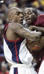 Stephane Lasme and Erroll Watson tie up a loose ball.