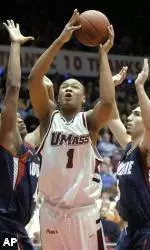 Rashaun Freeman gets between Duquense defenders Ron Dokes and Martin Osimani in the first half.