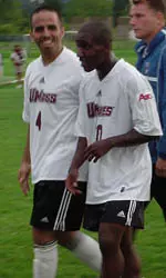 Oral Bullen is congratulated by Marco Tuesta after his two-goal game.