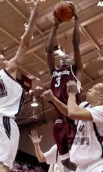 Maurice Maxwell is defended by Dwayne Jones (21) and John Bryant of Saint Joseph's in the first half.