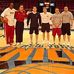 The UMass coaching staff on the floor at Madison Square Garden.