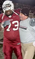 David Thompson and Don Brown embrace after a playoff win.