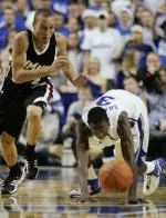 Massachusetts' James Life, left, out runs Kentucky's Ramel Bradley to a loose ball. (AP Photo)