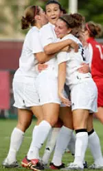Britt Canfield, Vanessa Patry and Sydney Stoll celebrate UMass' win over BU on Wednesday.