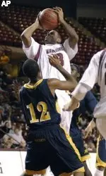 Gary Forbes shoots above Toledo's Corey Bingham in the first half.