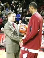 Gary Forbes was presented the ball he scored his 1,000th career point before the Toledo win.