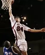 Tony Gaffney dunks over a Blue Devil defender.