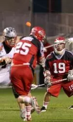 Sean Morris (#25) taking a shot with another former Minuteman, Kevin Leveille (#19) watching.