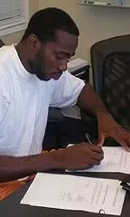 Stephane Lasme signing his NBA contract.