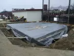 Tarps are currently protecting the site from rain and snow.