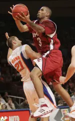 Massachussetts guard Gary Forbes, right, drives against Florida's Dan Werner during the first half in a semifinal game of the NIT college basketball tournament, Tuesday, April 1, 2008 at Madison Square Garden in New York.(AP Photo/Julie Jacobson)
