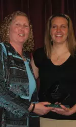 Head Coach Marnie Dacko presents Kate Mills with the Jack Leaman Award.