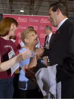 Derek Kellogg greets Rita and Laurie Leaman after his press conference.