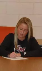 Riley Perry signs her NLI to come to UMass.