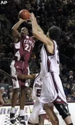 Temple's Dionte Christmas (22) shoots over Massachusetts' Luke Bonner in the second half of an NCAA college basketball game in Amherst, Mass., Saturday, Jan. 17, 2009. Massachusetts won, 79-75.