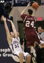 Tony Gaffney attempts a layup during the first half Of Massachusett's 82-80 loss to Xavier.