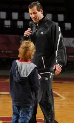 Derek Kellogg greeting a young fan.
