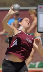 Lisa Wilson bested her own school record in the shot put at the New England Championships on Saturday.