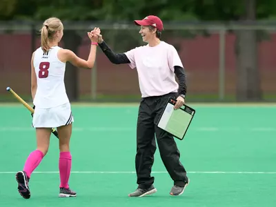 Head coach Amy Robertson celebrates with Anne Dijkstra
