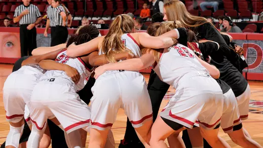 women's basketball team huddle