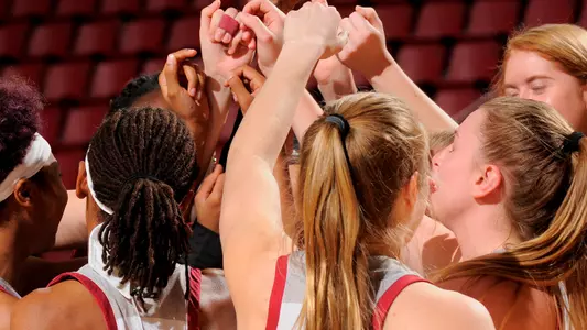women's basketball team huddle
