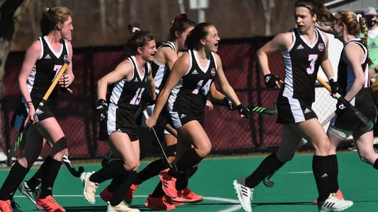 Josie Rossbach celebrates a goal against Maine (3/12/21)
