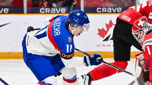 OTTAWA, CANADA - DECEMBER 27: Goaltender Christian Kirsch #1 of Team Switzerland stops Lukas Klecka #11 of Team Slovakia in the third period of the Group B match during the 2025 IIHF World Junior Championship at The Arena at TD place on December 27, 2024 in Ottawa, Ontario, Canada. Team Slovakia defeated Team Switzerland 2-1. (Photo by Minas Panagiotakis/Getty Images)