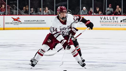 Gavin Cornforth carries the puck against Northeastern