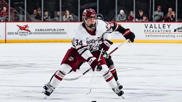 Gavin Cornforth carries the puck against Northeastern