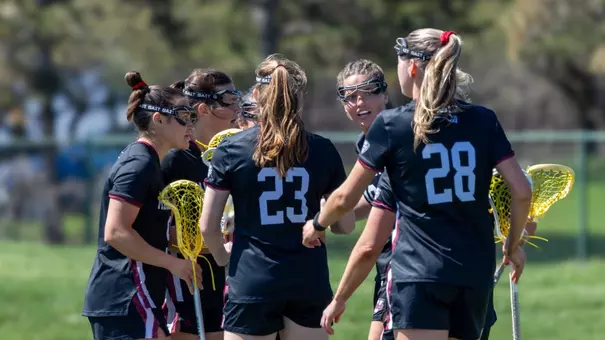 Players huddled on the field at Eastern Michigan