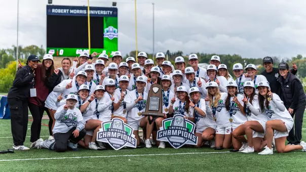 Women's Lacrosse 2026 MAC Champions - Team poses after championship game with trophy