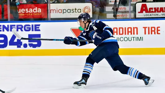 Maxim Massé shoots the puck for Chicoutimi of the QMJHL