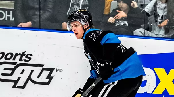 Mathieu Taillefer in black and blue jersey on the ice