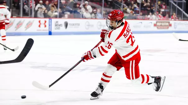 John McNelis shoots the puck as a member of the BU Terriers