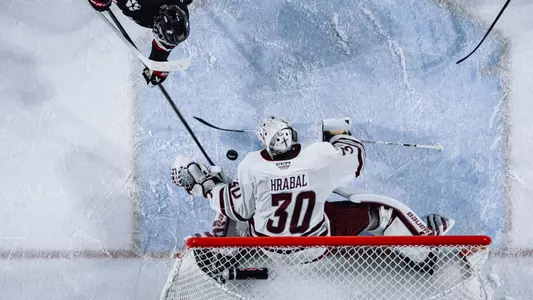 Michael Hrabal makes a save against Northeastern in the Hockey East playoffs