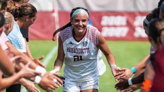 Annie McCaffrey runs through line of teammates as starters are announced