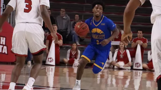 Bishop's Last Second Free Throws Lift Roos To Victory Over Yotes