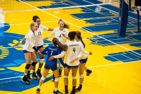 Volleyball Huddles up after winning a point against Louisiana Tech