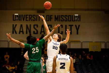 Josiah Allick Battles for a tip off to open the 2019-20 season