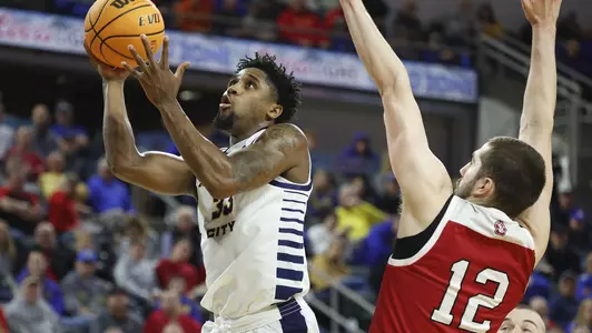 SIOUX FALLS, SD - MARCH 6: Marvin Nesbitt Jr. #33 of the UMKC Kangaroos takes the ball to the basket against the South Dakota Coyotes at The Summit League Basketball Tournament at the Denny Sanford Premier Center on March 5, 2022 in Sioux Falls, South Dakota. (Photo by Richard Carlson/Inertia)