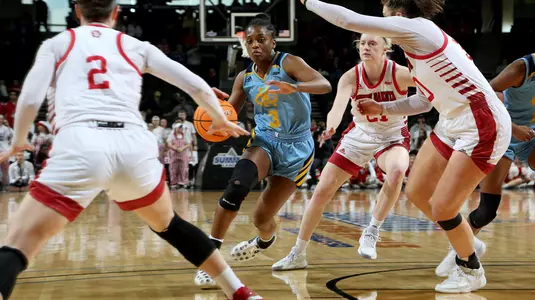 SIOUX FALLS, SD - MARCH 7: Naomie Alnatas #3 of the UMKC Kangaroos drives into the lane against the South Dakota Coyotes at The Summit League Basketball Tournament at the Denny Sanford Premier Center on March 7, 2022 in Sioux Falls, South Dakota. (Photo by Dave Eggen/Inertia)